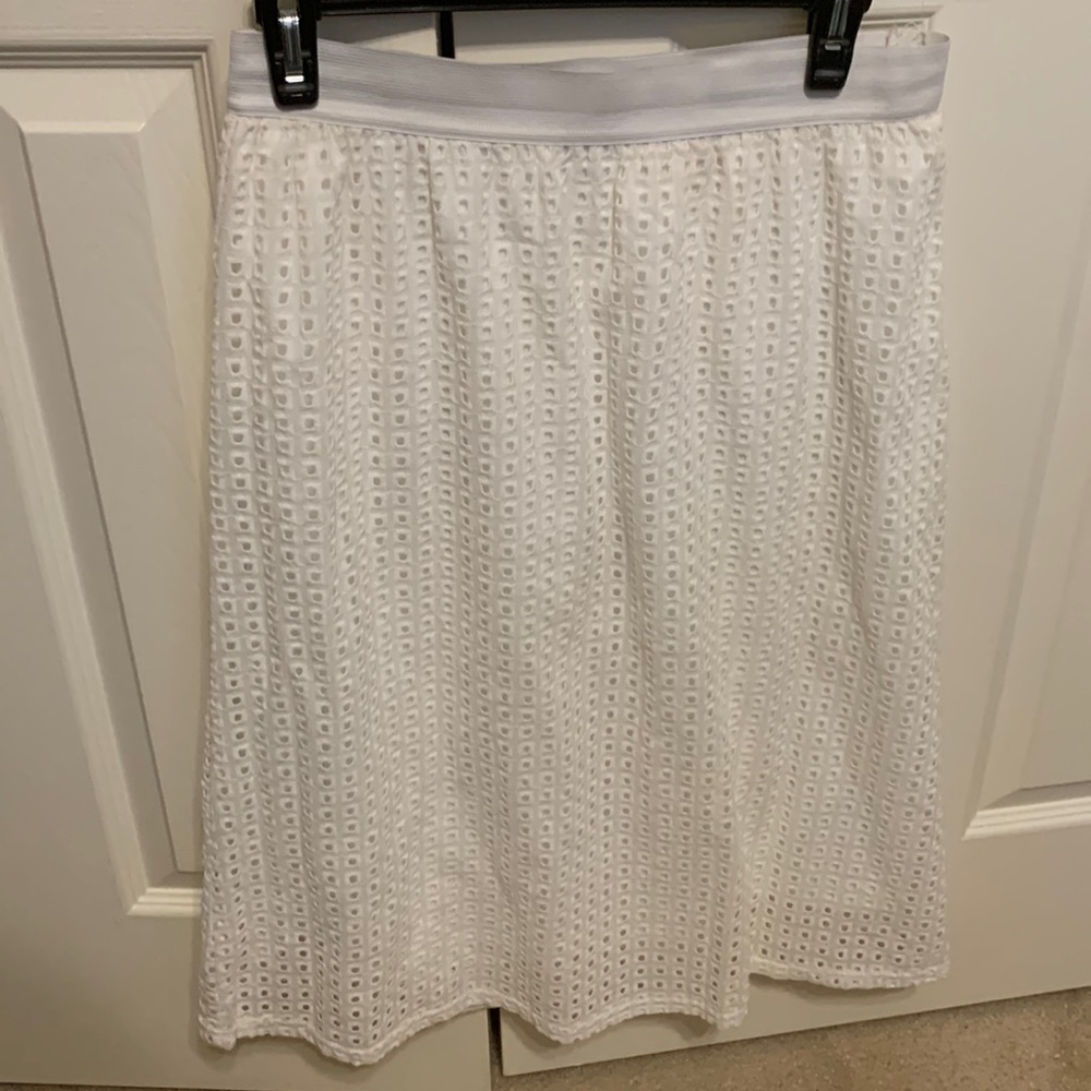 JUSTFAB skirt. Elastic waist, hit at the knee. Eyelet fabric with lining